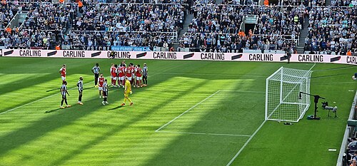 Premier League match seen from behind the goal